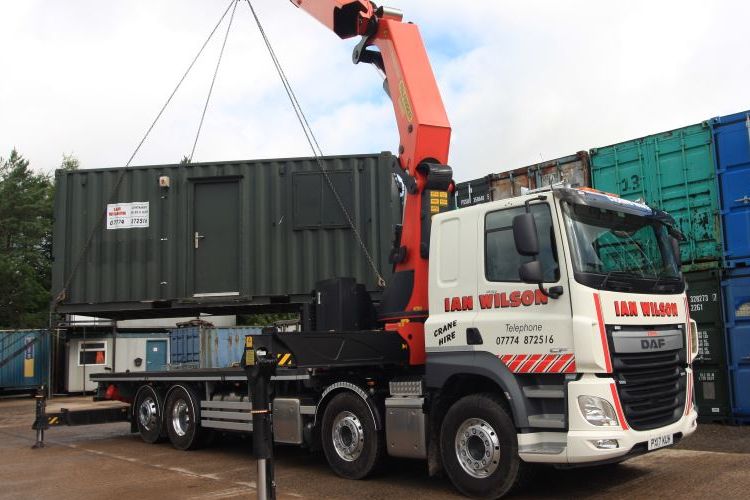 Ian Wilson Haulage, uplifting a portable office container from the Lillyhall base near Workington, Cumbria
